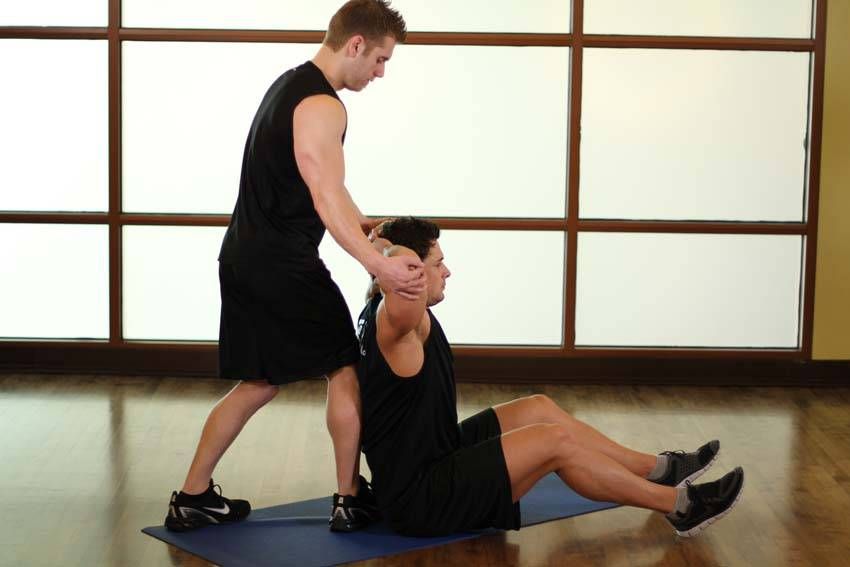 Behind-the-Head Chest Stretch exercise demonstration — targets the chest