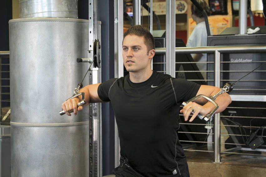 Standing Cable Chest Press exercise demonstration, targeting the chest