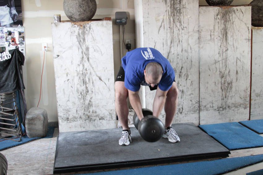 Circus Dumbbell Press exercise demonstration — targets the shoulders