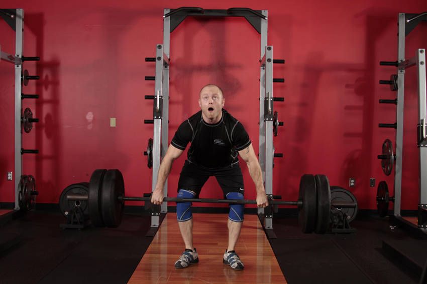 Clean and Jerk exercise demonstration — targets the quads