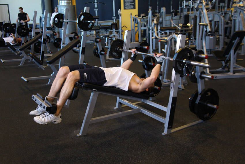 Decline Barbell Bench Press exercise demonstration, targeting the chest