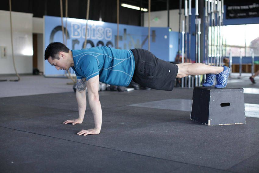 Decline Push-Up exercise demonstration, targeting the chest
