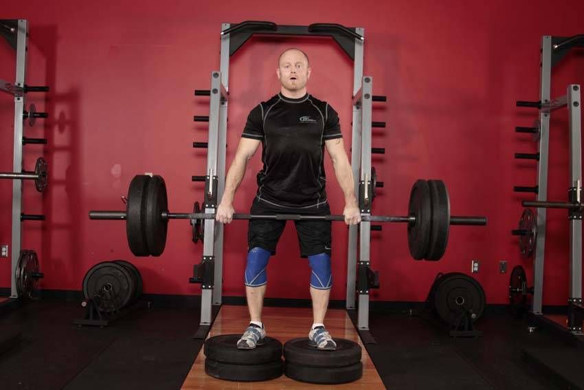 Deficit Romanian Deadlift exercise demonstration, targeting the hamstrings