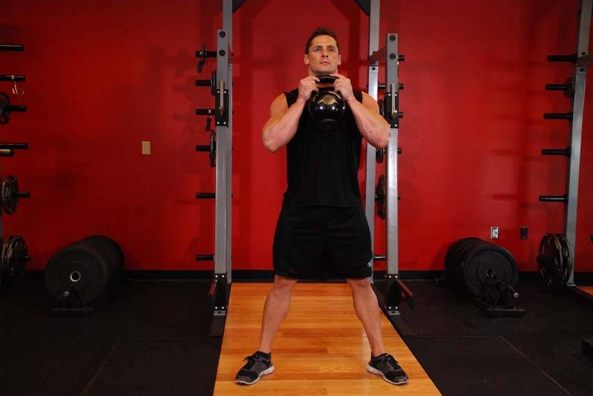 Kettlebell Goblet Squat exercise demonstration, targeting the quads