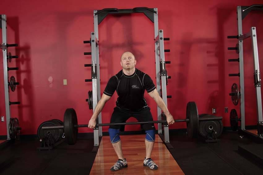 Hang Snatch exercise demonstration — targets the quads