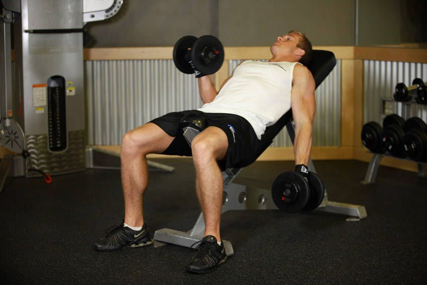 Incline Dumbbell Curl exercise demonstration, targeting the biceps