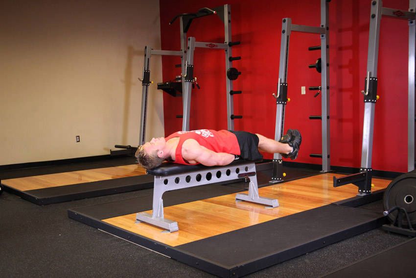 Lying Leg Raise exercise demonstration, targeting the abs