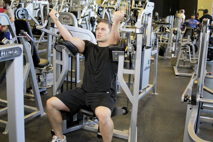 Machine Biceps Curl exercise demonstration, targeting the biceps