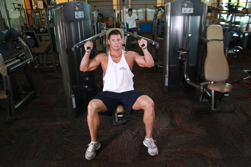 Machine Shoulder Press exercise demonstration, targeting the shoulders