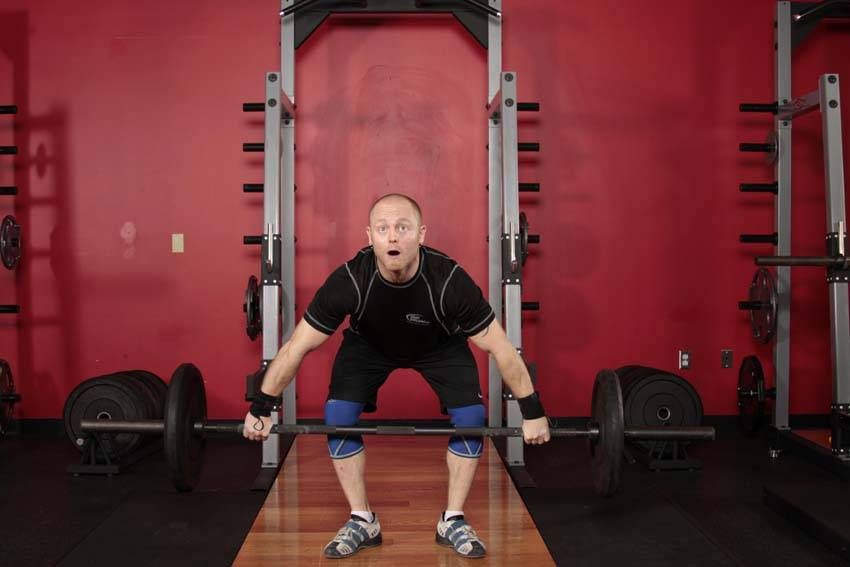 Muscle Snatch exercise demonstration — targets the traps