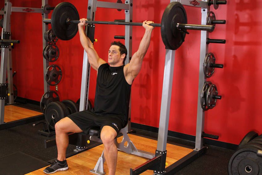 Seated Barbell Shoulder Press exercise demonstration, targeting the shoulders