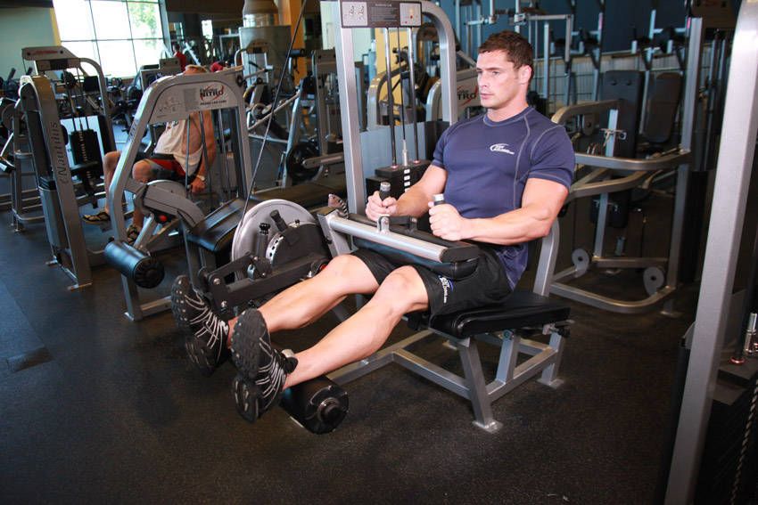 Seated Leg Curl demonstration, start of the movement, targeting the hamstrings