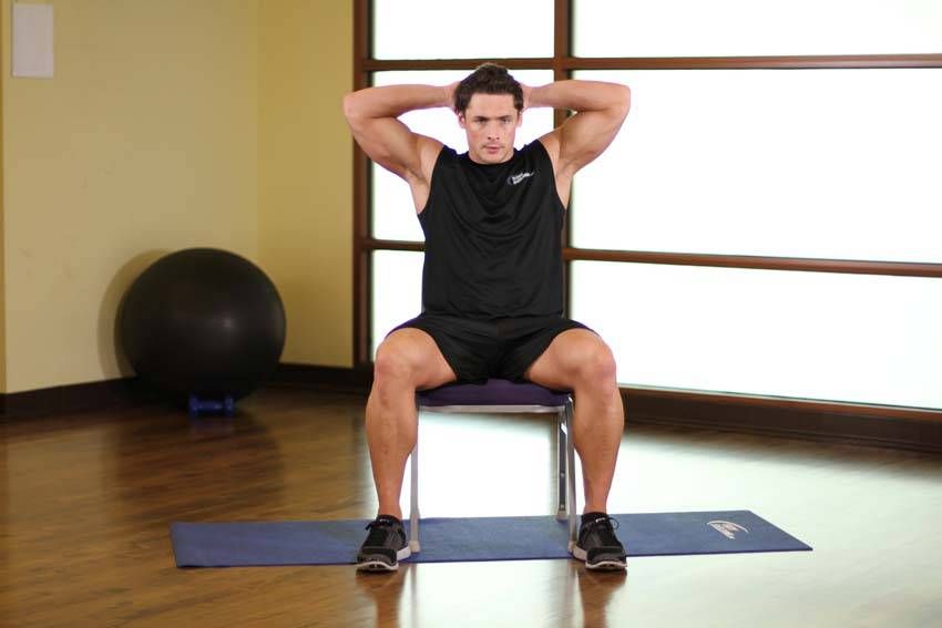 Seated Spinal Twist exercise demonstration — targets the obliques