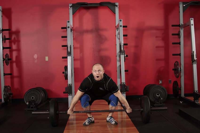 Snatch exercise demonstration — targets the quads