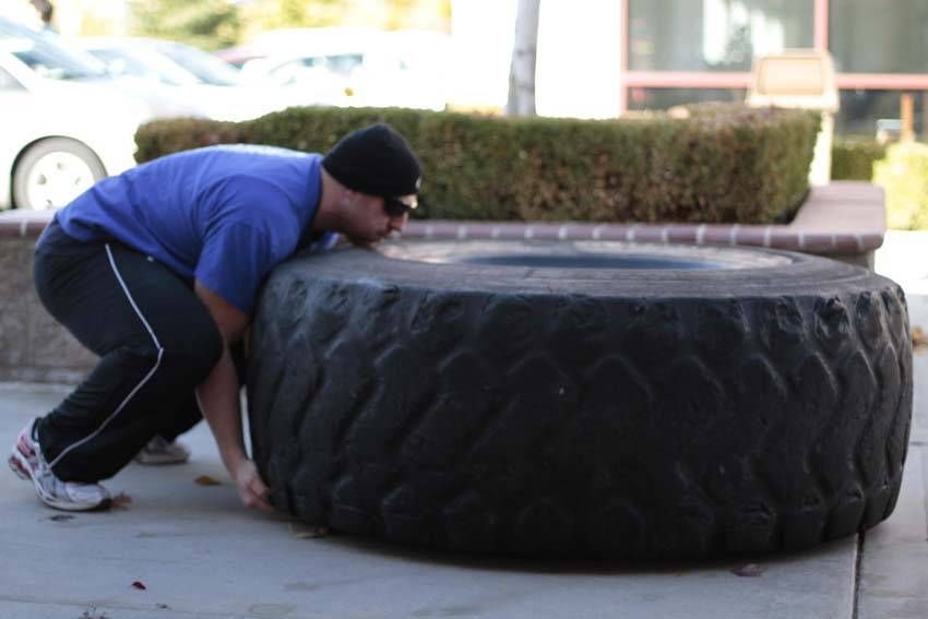 Tire Flip exercise demonstration — targets the quads